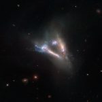 Cosmic “flying V” of merging galaxies