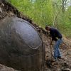 Mysterious giant sphere unearthed in forest divides opinion