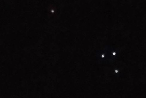 British bus driver videotapes triangle UFO
