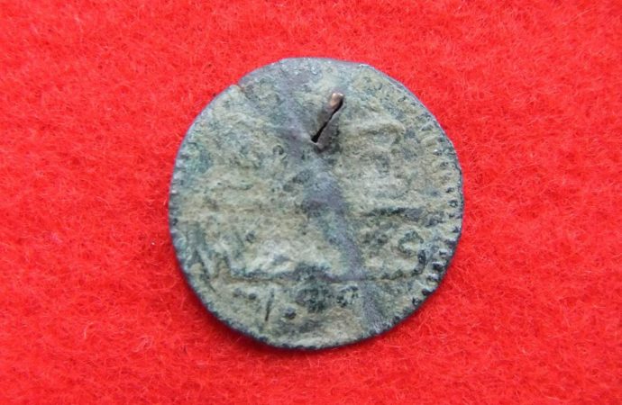 Four rusty Roman coins found buried underneath remote castle in Japan