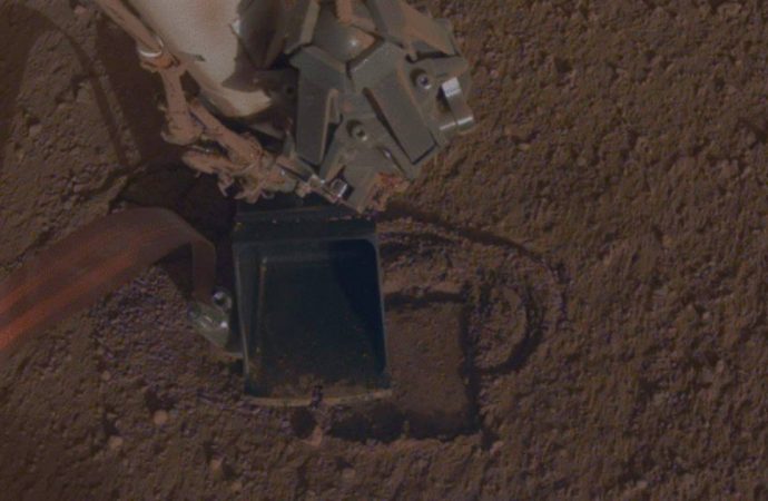 NASA InSight rover digs its ‘mole’ into the dusty Mars landscape