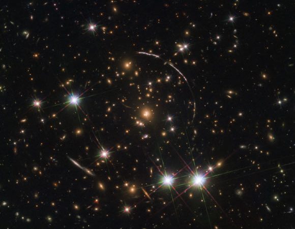 Hubble Sees Twelve Images of Same Galaxy Split by Gravitational Lens