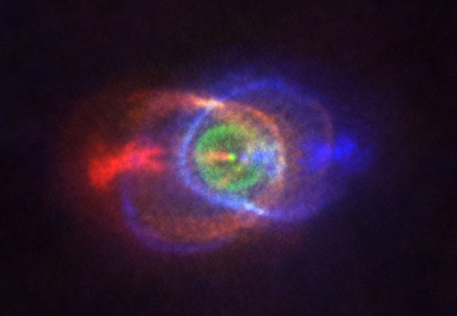 Spectacular rainbow cloud in space spawned by cosmic showdown between stars