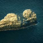 The largest volcano in the world sits beneath two small rocky peaks in Hawaii