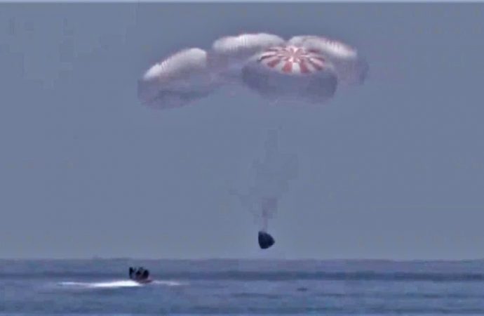 Nasa astronauts aboard SpaceX capsule make first splashdown in 45 years