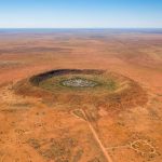 Meteorite crater discovered while drilling for gold in outback WA estimated to be 100 million years old